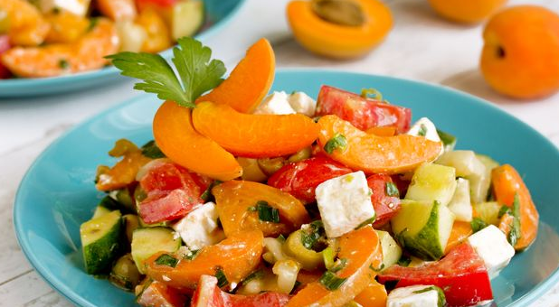 Vegetable salad with apricots, feta cheese and olives