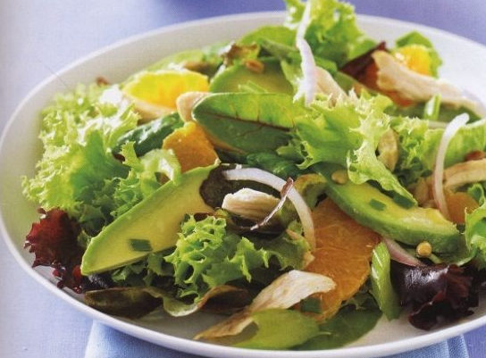 Green salad with avocado, chicken and tangerines