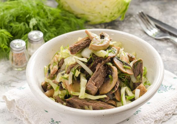Salad with beef, young cabbage and champignons