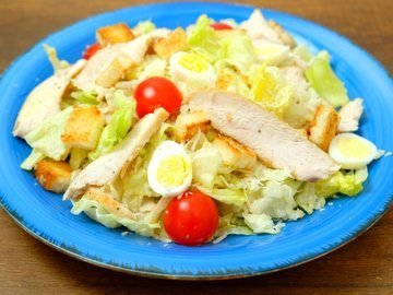 Caesar salad with chicken and Caesar dressing