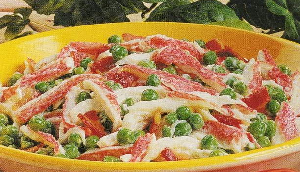 Salad with crab sticks, green peas and bacon