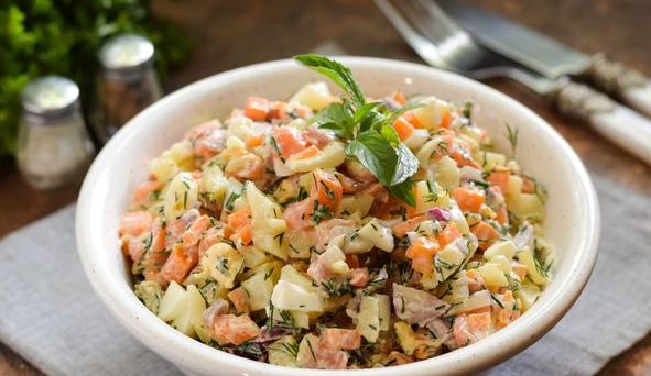 Tasty Salad with salmon, potatoes, carrots and eggs