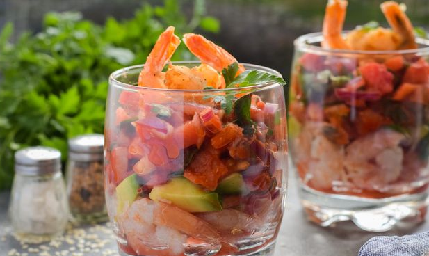 Shrimp cocktail salad with avocado and canned tomatoes