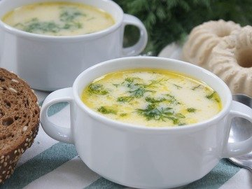 Soup with melted cheese in a slow cooker