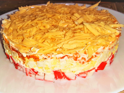 Layered salad with crab sticks and cheese