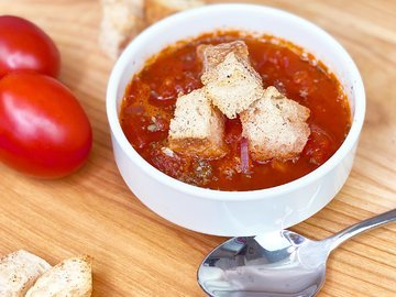 Tasty Italian tomato soup with croutons