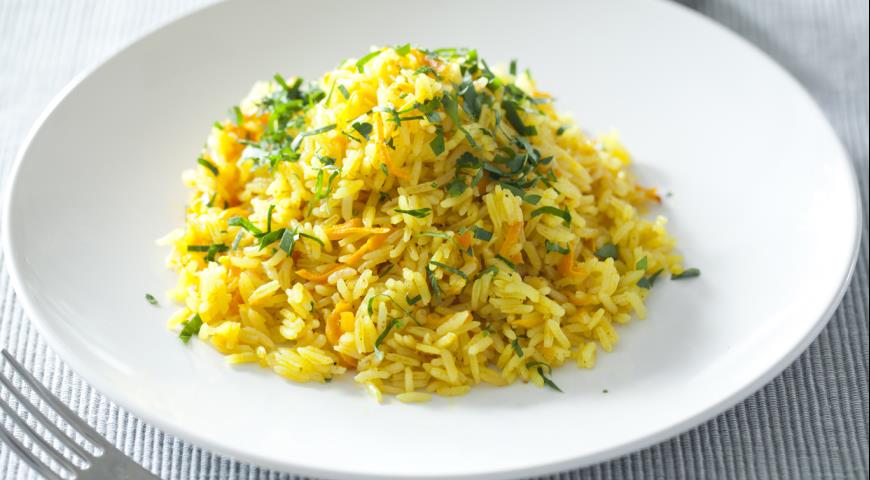 Delicious, aromatic rice with carrots for garnish