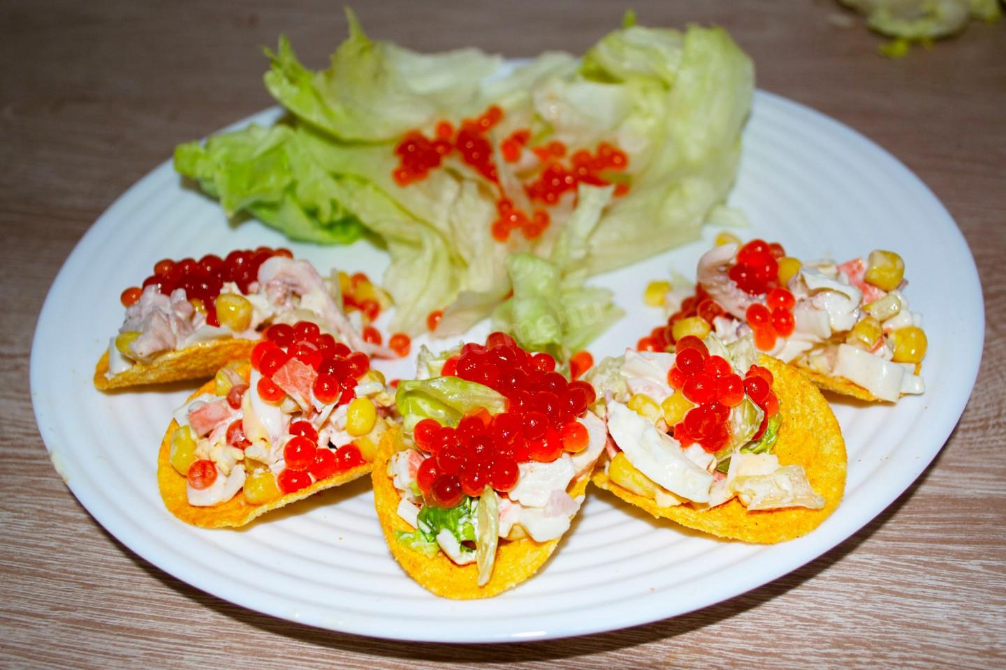 NEW YEAR SNACK FROM CRAB STICKS AND SQUIDS ON CHIPS