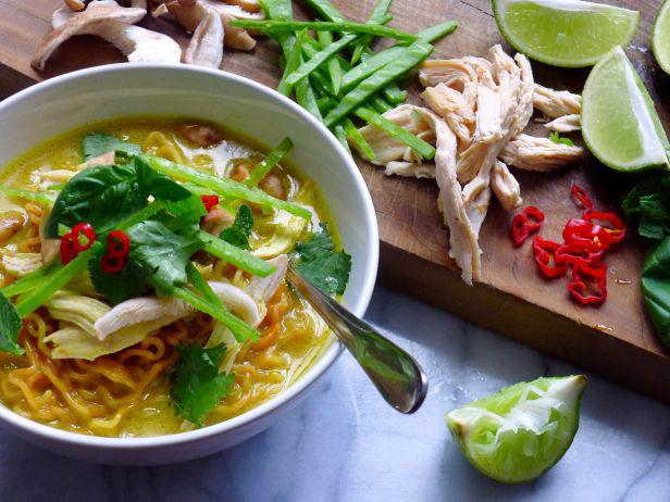 Spicy soup with coconut milk with curry and noodles