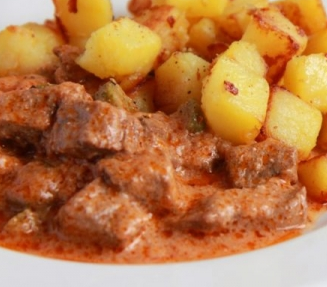 To sour cream and tomato sauce