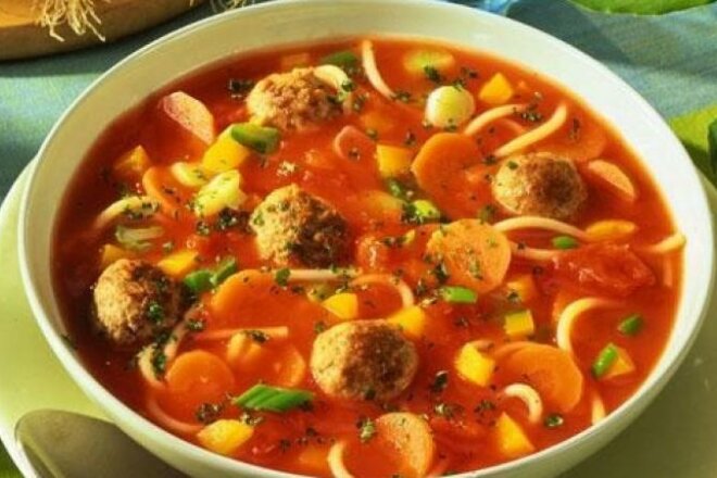 Italian tomato soup with sausages and noodles