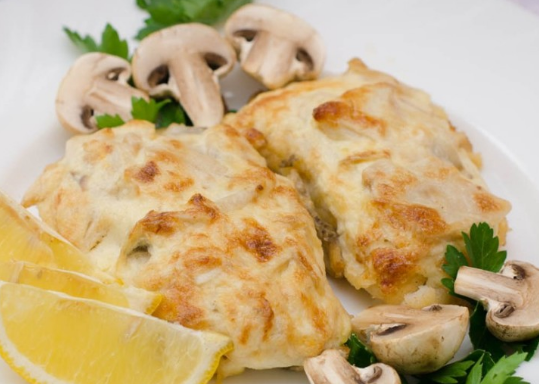 Pork in the oven with mushrooms in sour cream