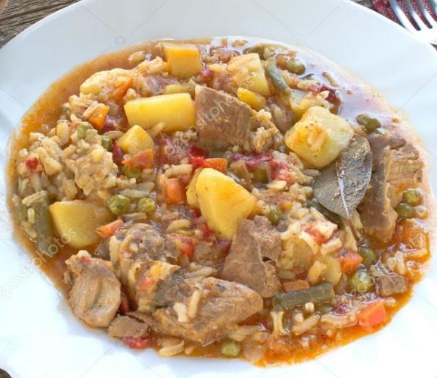 Pork in the oven with vegetables and rice