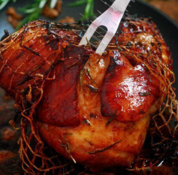 Baked pork in a glaze of balsamic vinegar
