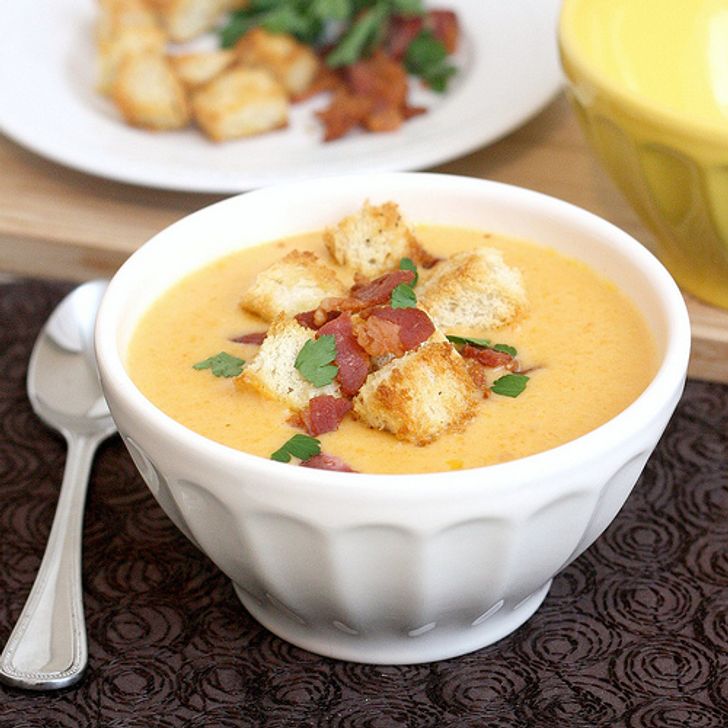 Creamy cheese soup with garlic croutons