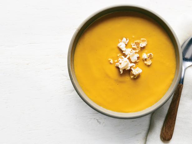 Pumpkin cream soup with curry and popcorn