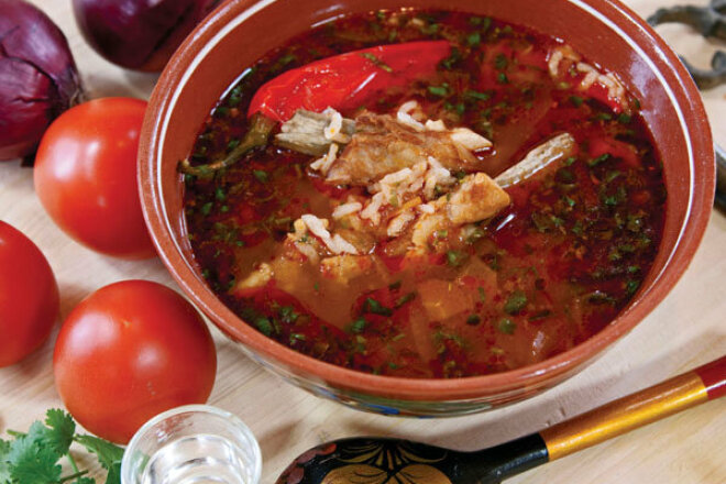 Kharcho soup with tomatoes and pomegranate juice in a slow cooker