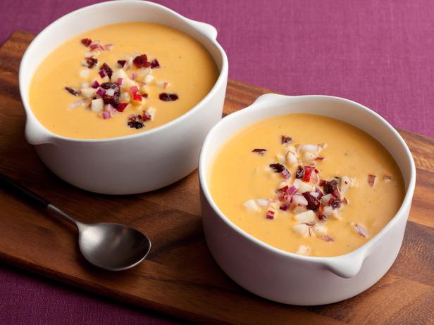 Pumpkin puree soup with cream and apple-cranberry dressing