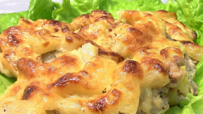 Pork in the oven with pineapple and cheese