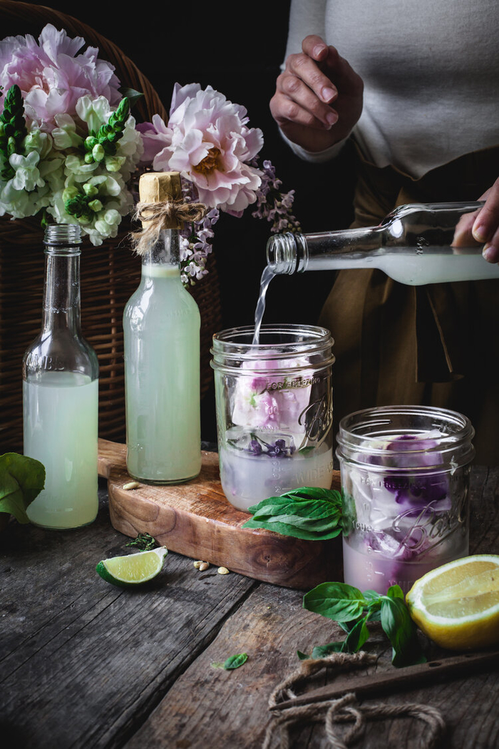 Basil syrup lemonade with edible flower ice cubes