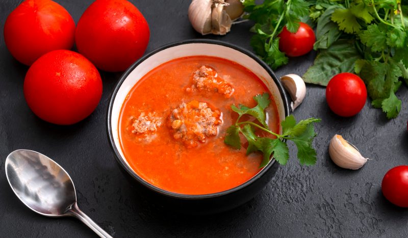 Tomato rice with soup and meatballs