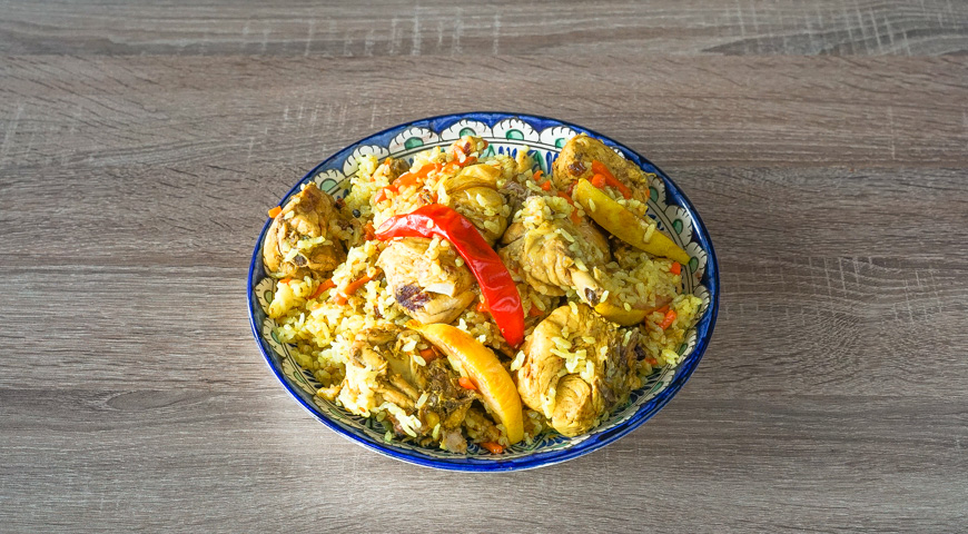 Pilaf with chicken in a cauldron