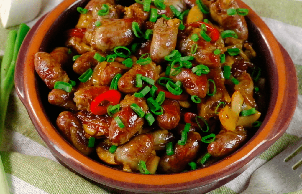 Chicken hearts with tomatoes and peppers
