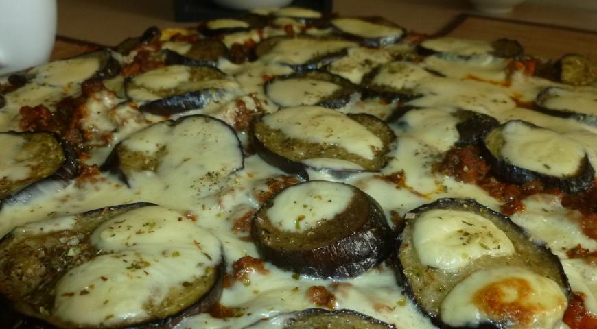Meat pizza with eggplant and feta cheese