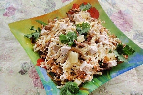 Salad with mushrooms and pineapples