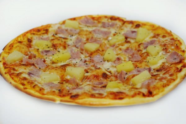 Pizza with pineapple and chicken breast