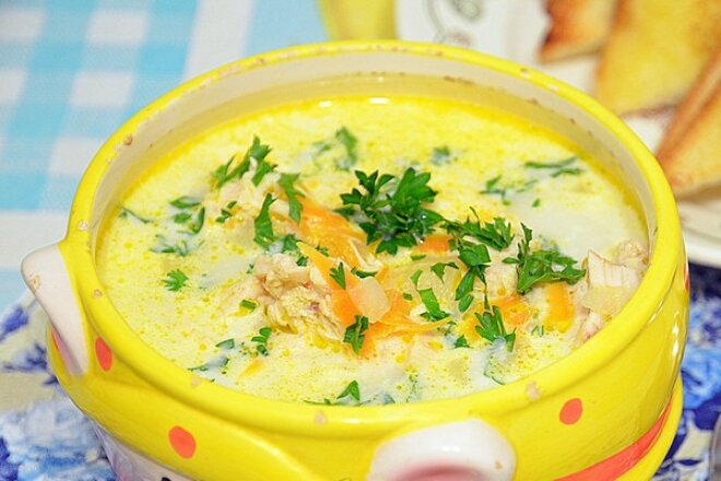 Processed cheese soup with sausages in a slow cooker