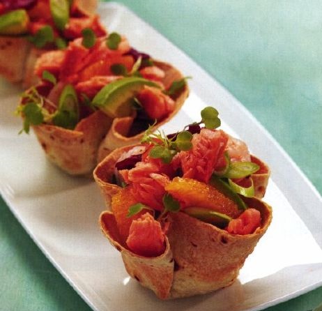 Salmon with shrimps and avocado in baskets
