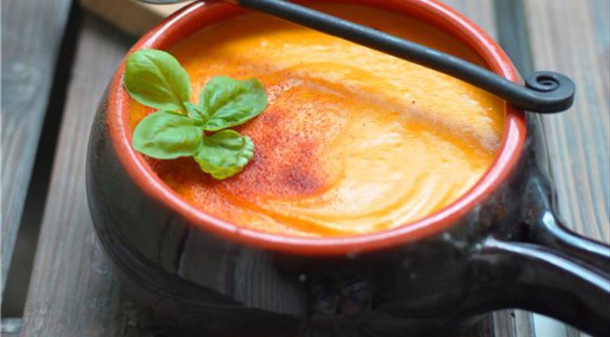Baked pumpkin and potato cream soup with melted cheese