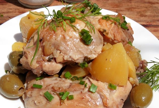 Rabbit stewed with potatoes and olives in wine (in the oven)