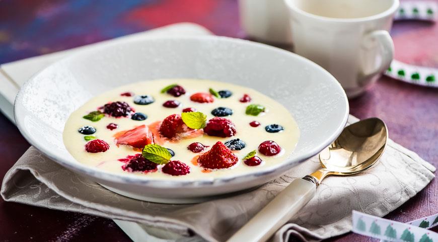 White chocolate soup with melting berries