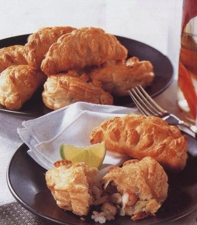Puff pastry pies with rice, fish and shrimps