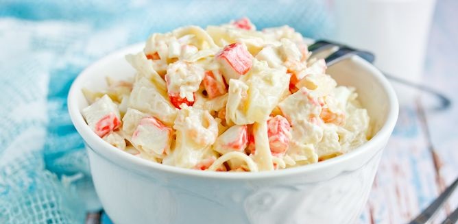 Salad with crab sticks, shrimps and pineapple