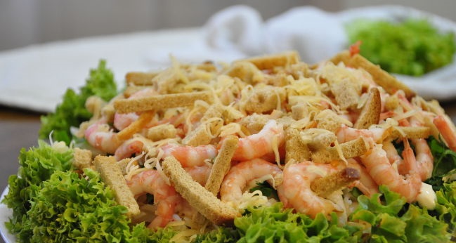 Caesar salad with shrimps and crab sticks