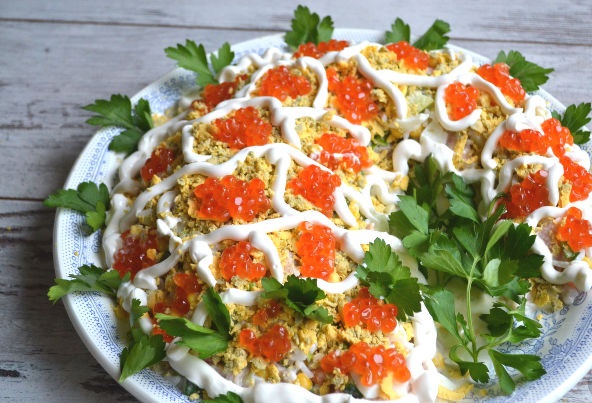 Cornucopia salad with caviar, shrimps and salmon