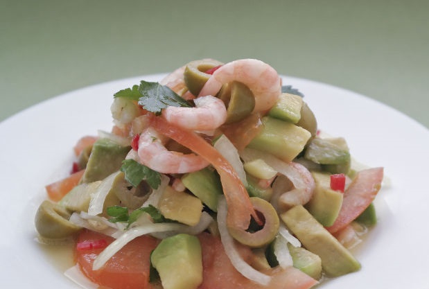 Original salad with shrimp and avocado, under the curtain with white wine