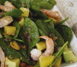 Shrimp salad with avocado, spinach and oranges