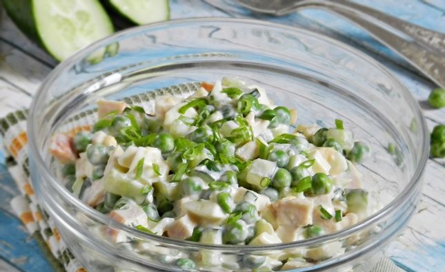 Salad with smoked chicken, cucumber, green peas and eggs