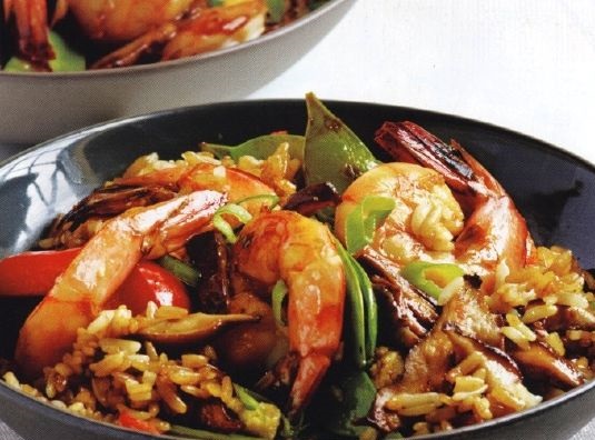 Fried shrimps with mushrooms and green peas