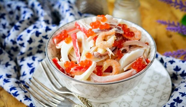 Sea salad with squid, shrimps and crab sticks
