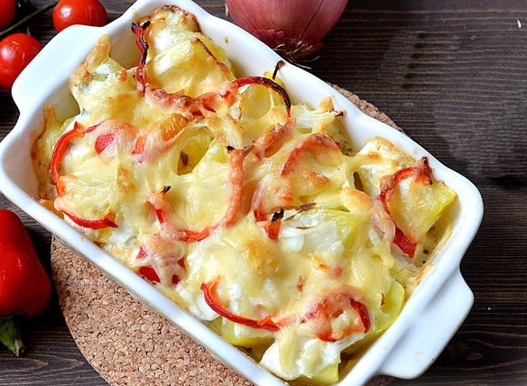 Baked potatoes with cheese, onions and bell pepper