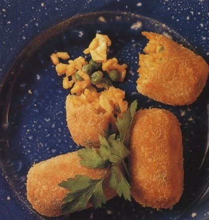 Rice, shrimp, chicken, green peas and corn croquettes