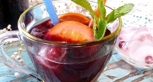 Blueberry iced tea with mint and basil