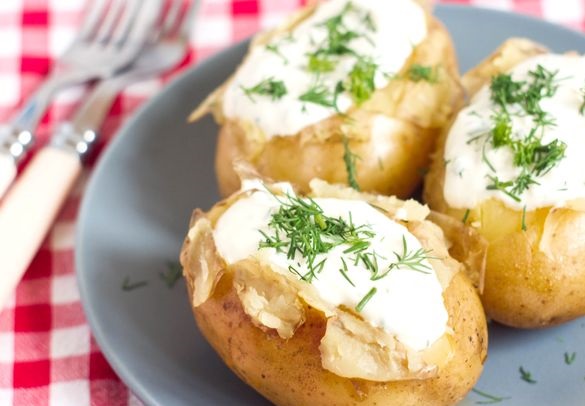 Baked potatoes with sour cream and garlic sauce