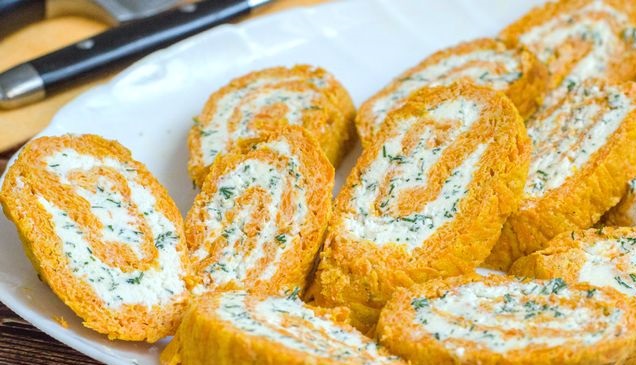Carrot snack roll with cream cheese and herbs