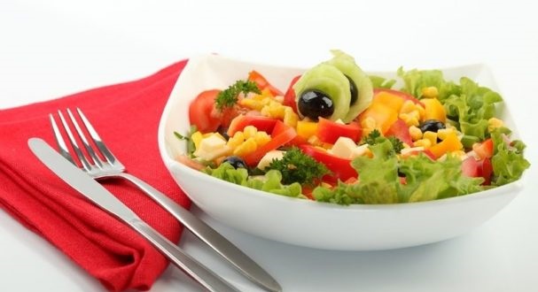 Salad with corn, cheese, tomatoes